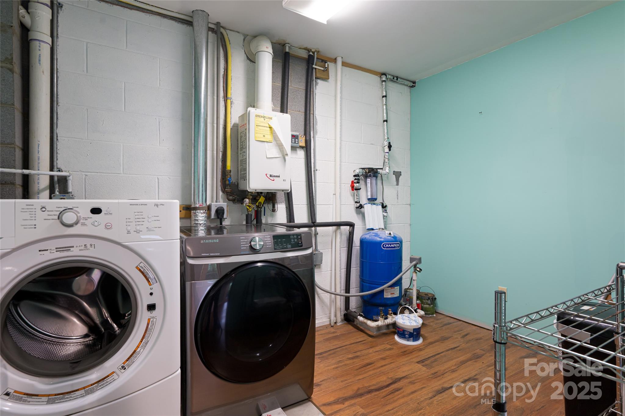 4035 Bald Creek Road Clyde, NC 28721 - Photo 31 of 42 a room with stainless steel appliances lots of countertop furniture and a wooden floor