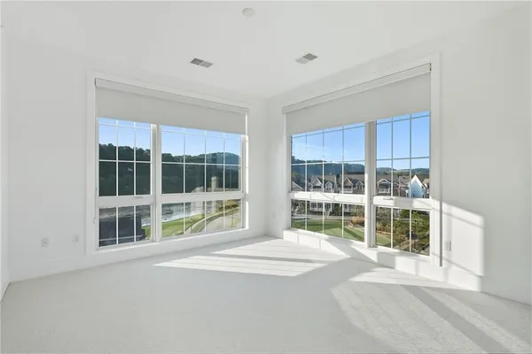 a view of an empty room with a large window