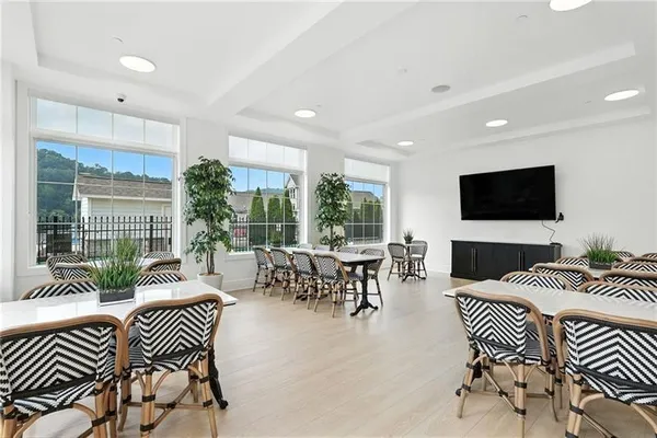 a outdoor living space with furniture and a flat screen tv