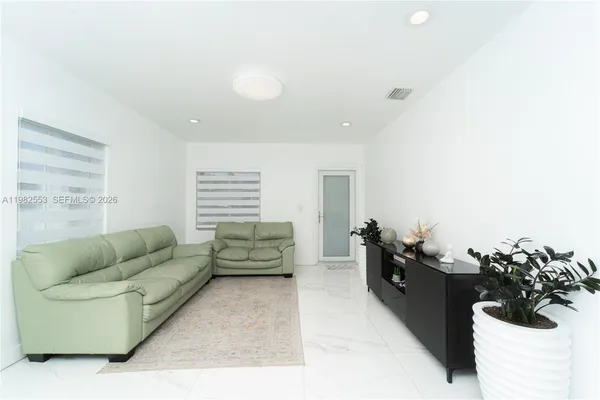 a living room with furniture and a couch