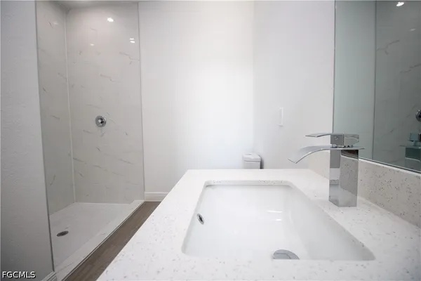 a bathroom with a tub and shower