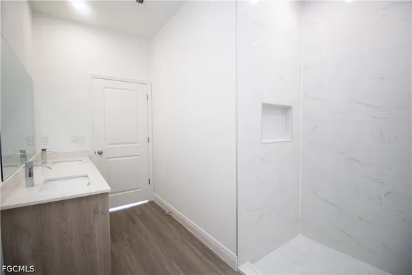 a bathroom with a sink and a mirror