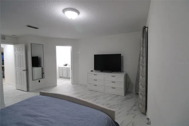 a view of a livingroom with a flat screen tv