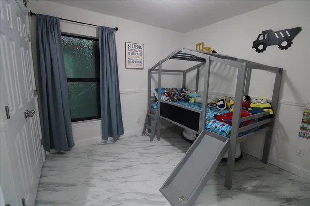 a bathroom with a sink a toilet and shower curtain