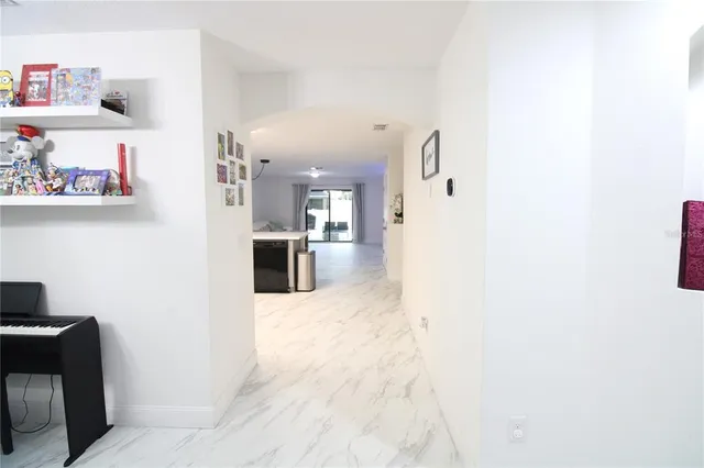 a view of a kitchen with furniture and wooden floor