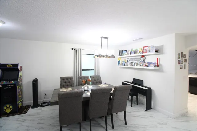 a view of a dining room with furniture