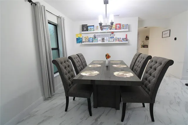 a view of a dining room with furniture