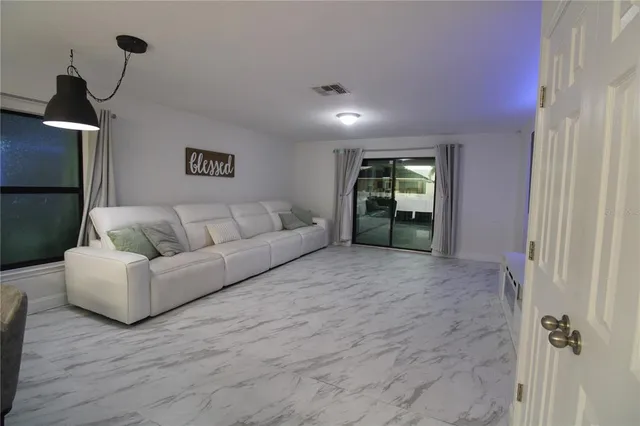 a living room with furniture and a window