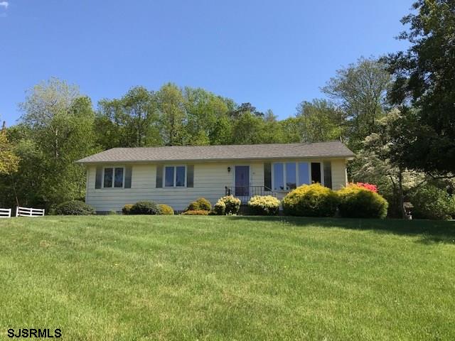 41 Roberts Road Bridgeton, NJ 08302 - Photo 1 of 15 a front view of a house with garden and trees
