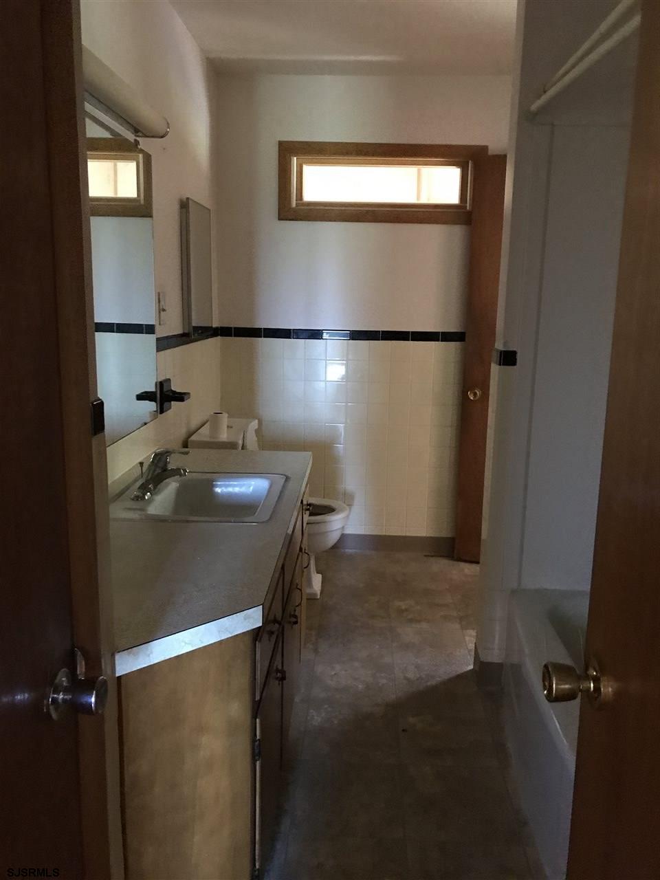 41 Roberts Road Bridgeton, NJ 08302 - Photo 12 of 15 a bathroom with a sink and a mirror