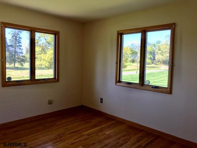 41 Roberts Road Bridgeton, NJ 08302 - Photo 13 of 15 a view of an empty room with wooden floor and a window
