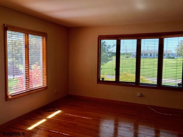 41 Roberts Road Bridgeton, NJ 08302 - Photo 7 of 15 a view of an empty room with wooden floor and a window