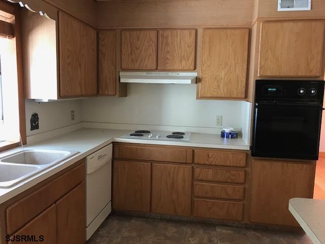 41 Roberts Road Bridgeton, NJ 08302 - Photo 8 of 15 a kitchen with cabinets appliances and a sink