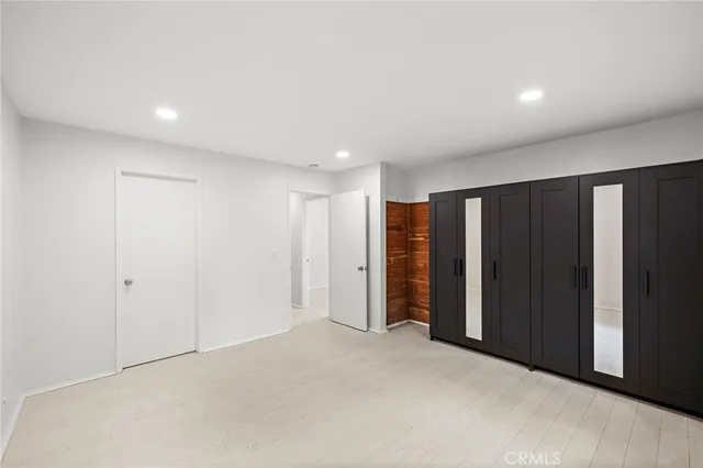 a bathroom with a shower sink vanity mirror and toilet