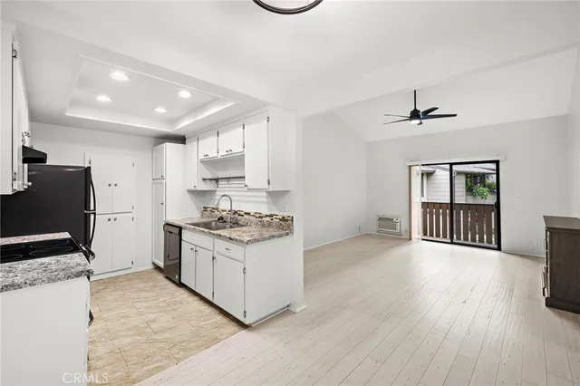 a kitchen with stainless steel appliances granite countertop a stove and a refrigerator