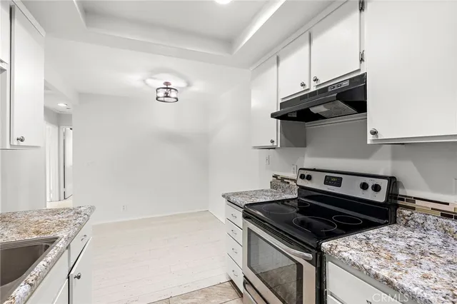 a kitchen with a stove and a microwave