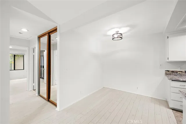 wooden floor in an empty room and a window