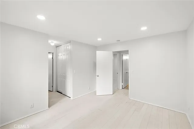 a bathroom with a sink a toilet a mirror and shower