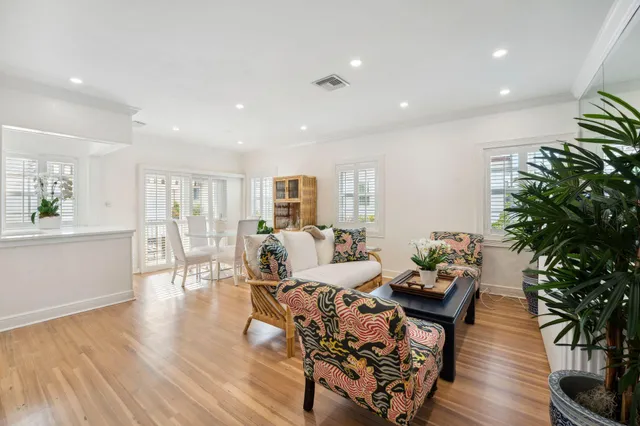 a kitchen with stainless steel appliances a sink a stove a microwave and a refrigerator