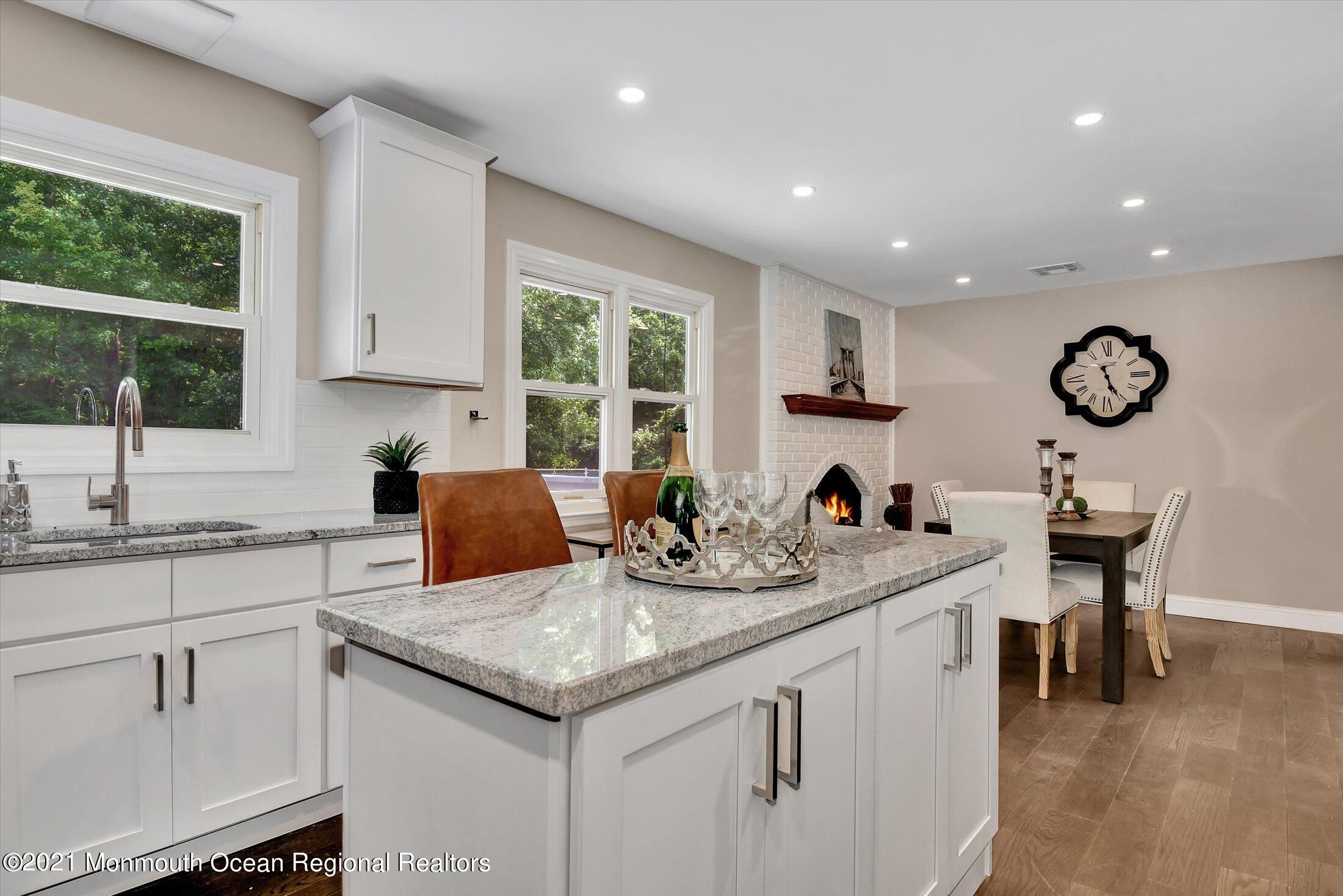 347 Iron Ore Road Manalapan, NJ 07726 - Photo 13 of 27 a kitchen with sink cabinets and window