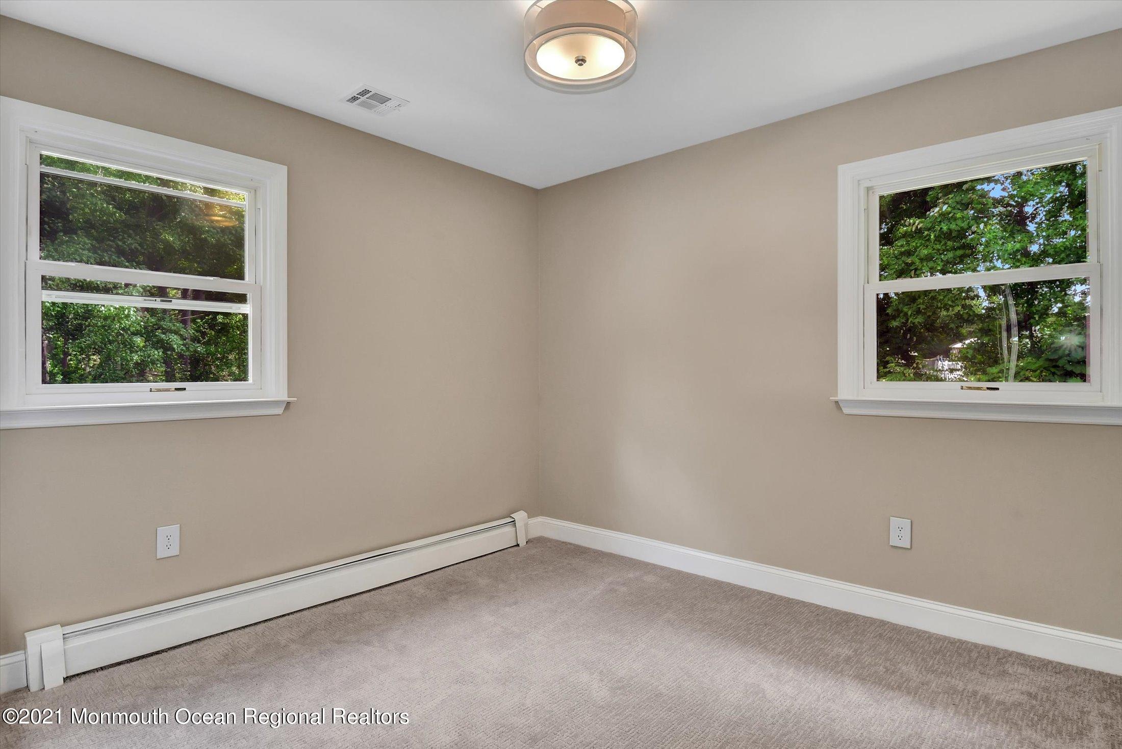 347 Iron Ore Road Manalapan, NJ 07726 - Photo 17 of 27 an empty room with a window