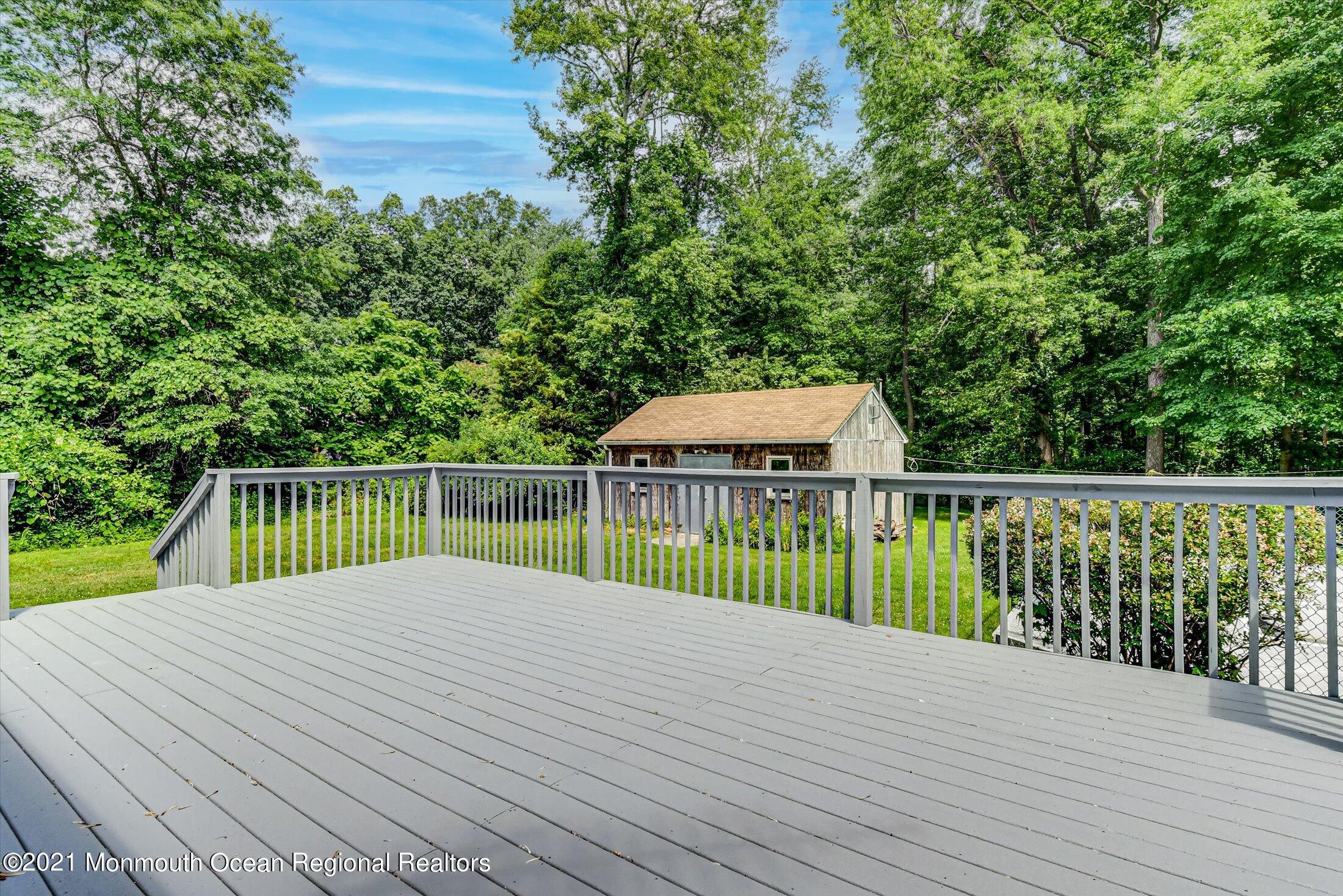 347 Iron Ore Road Manalapan, NJ 07726 - Photo 23 of 27 a view of a balcony with wooden floor