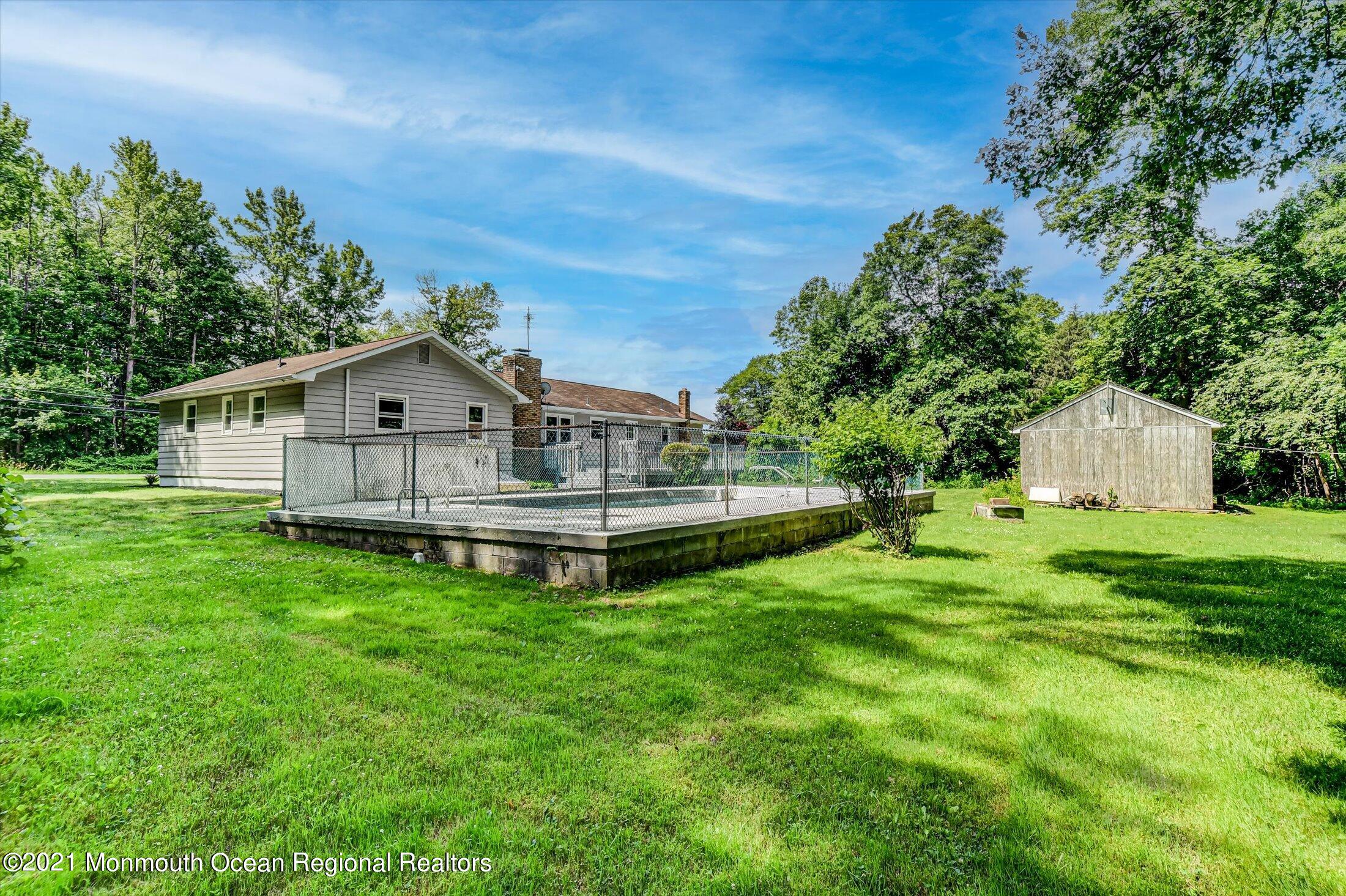 347 Iron Ore Road Manalapan, NJ 07726 - Photo 24 of 27 a view of a house with a yard balcony and sitting area