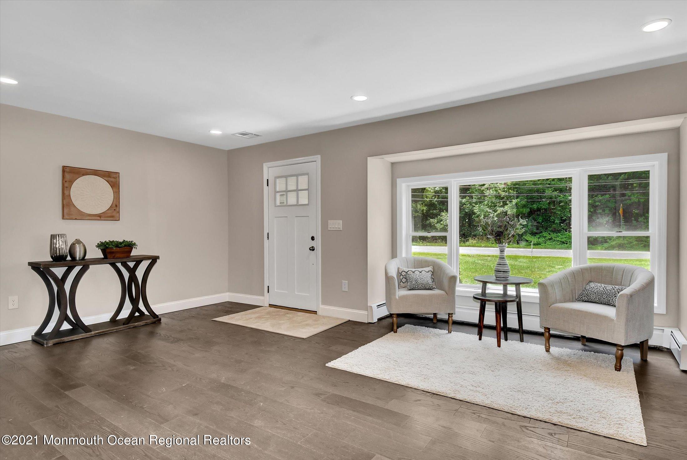 347 Iron Ore Road Manalapan, NJ 07726 - Photo 5 of 27 a living room with furniture and a large window