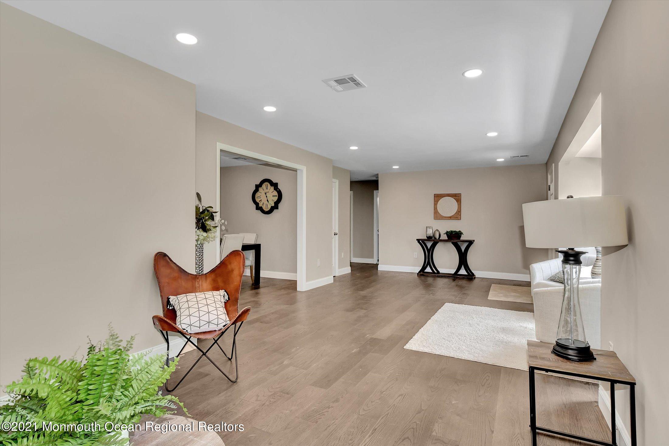 347 Iron Ore Road Manalapan, NJ 07726 - Photo 7 of 27 a view of a room with table tennis table and chair