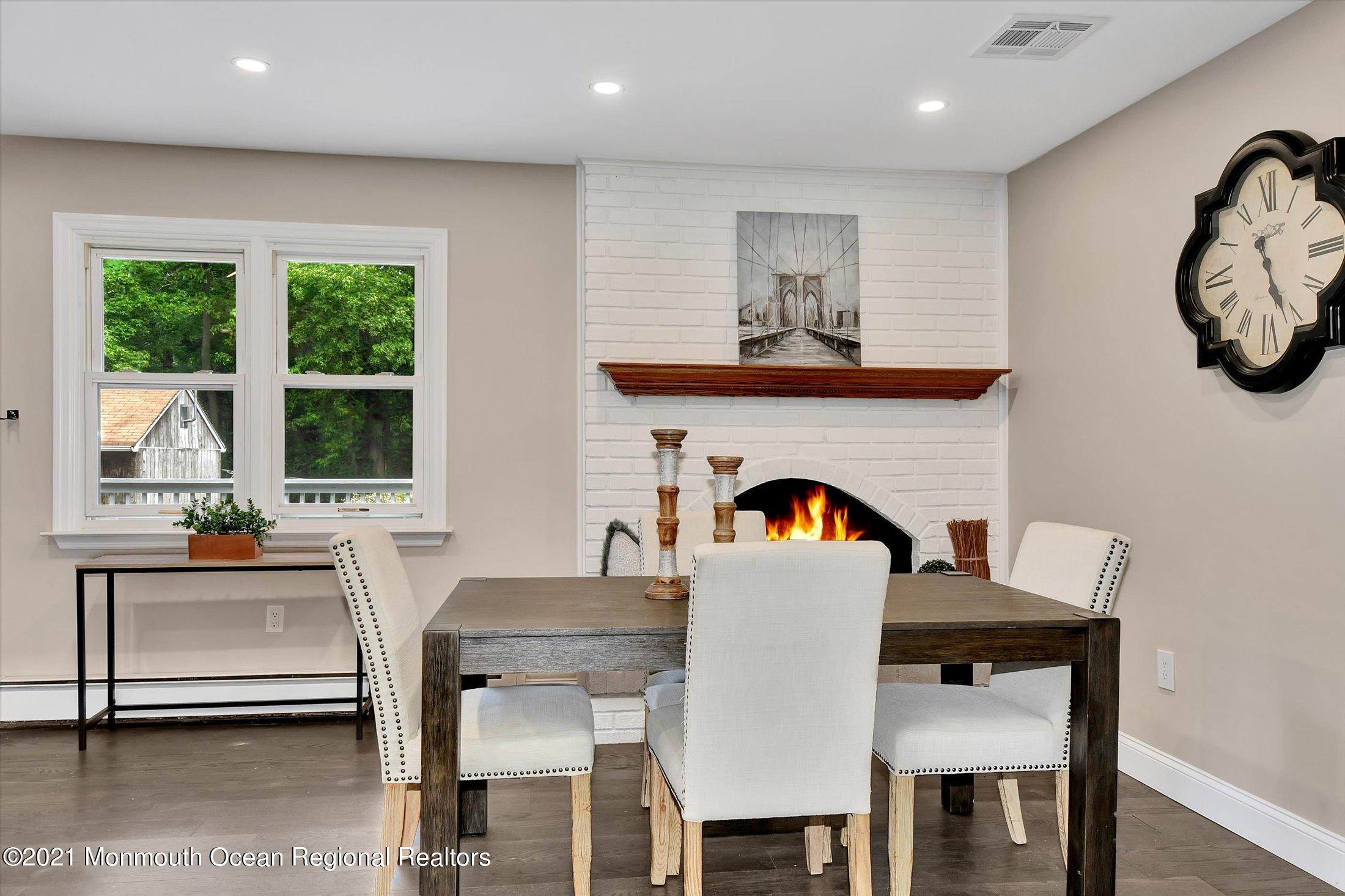 347 Iron Ore Road Manalapan, NJ 07726 - Photo 8 of 27 a view of a dining room with furniture window and outside view