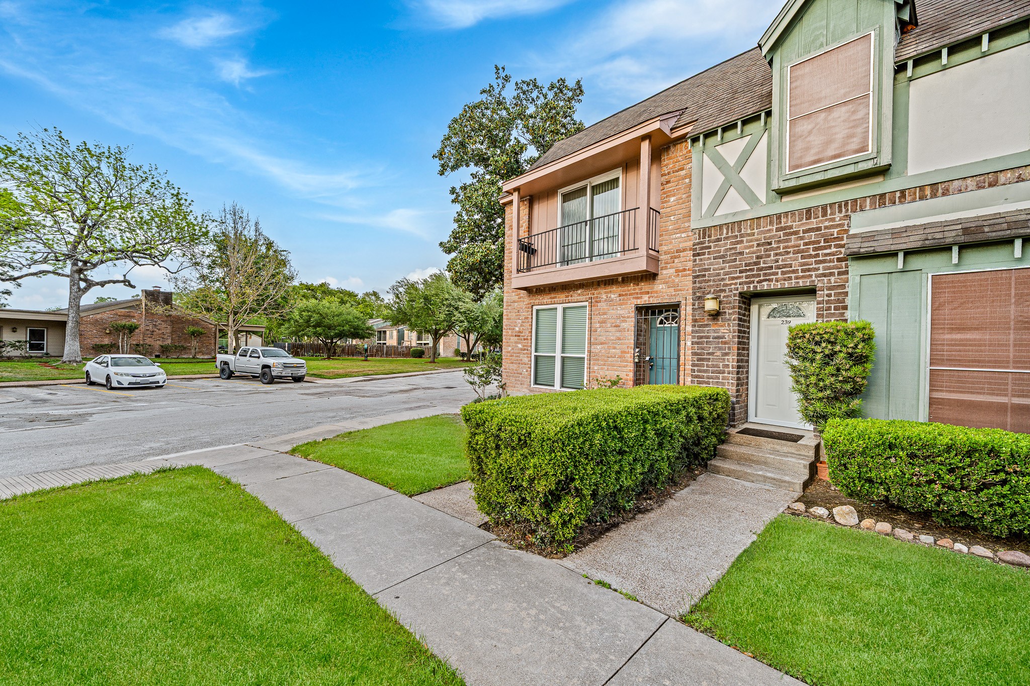 830 Threadneedle Street, Unit 240 Houston, TX 77079 - Photo 3 of 33 Charming two-story townhouse with a brick exterior, featuring a small balcony and well-maintained landscaping. Located on a quiet street with ample parking and mature trees, offering a welcoming and attractive curb appeal.