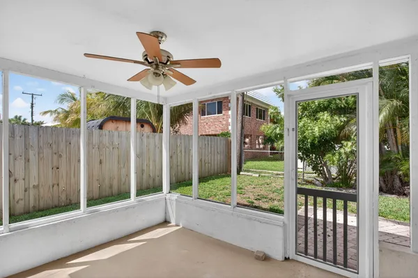 a view of a living room and balcony