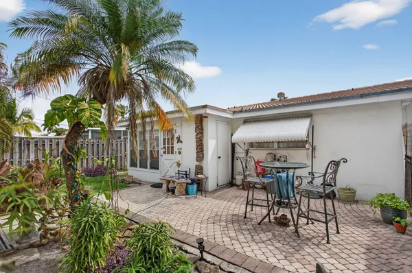 a view of a backyard with a patio