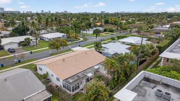 an aerial view of residential houses with outdoor space