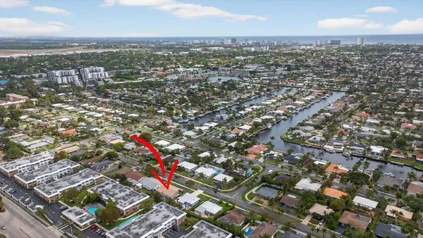 an aerial view of residential building with parking