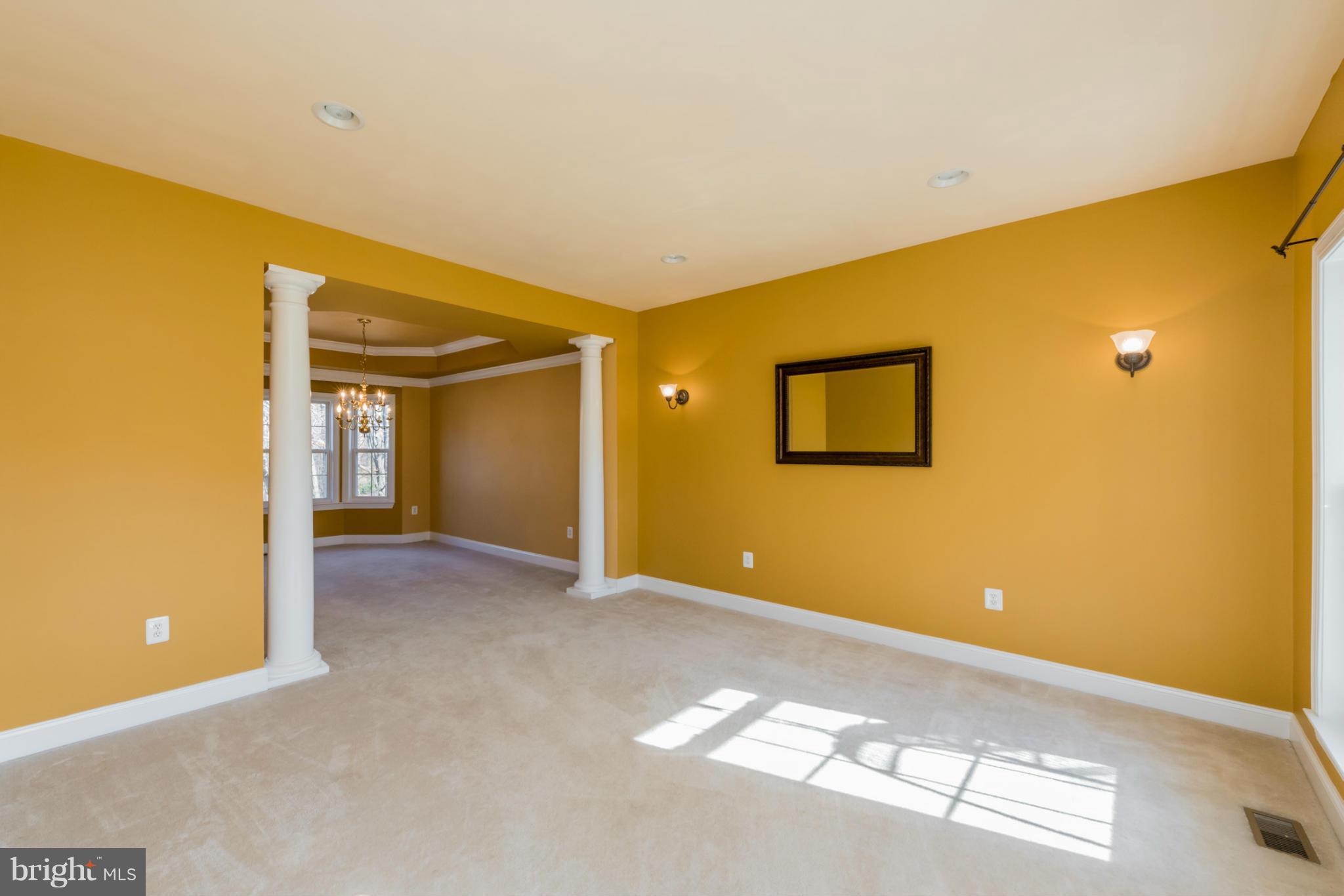3401 Evans Road Huntingtown, MD 20639 - Photo 11 of 30 a view of a big room with windows