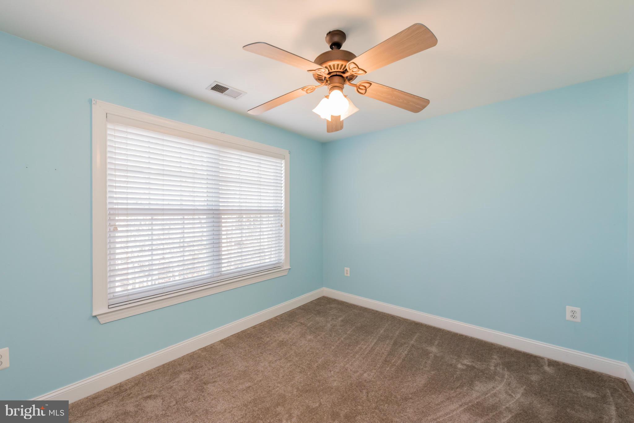 3401 Evans Road Huntingtown, MD 20639 - Photo 15 of 30 an empty room with window and fan