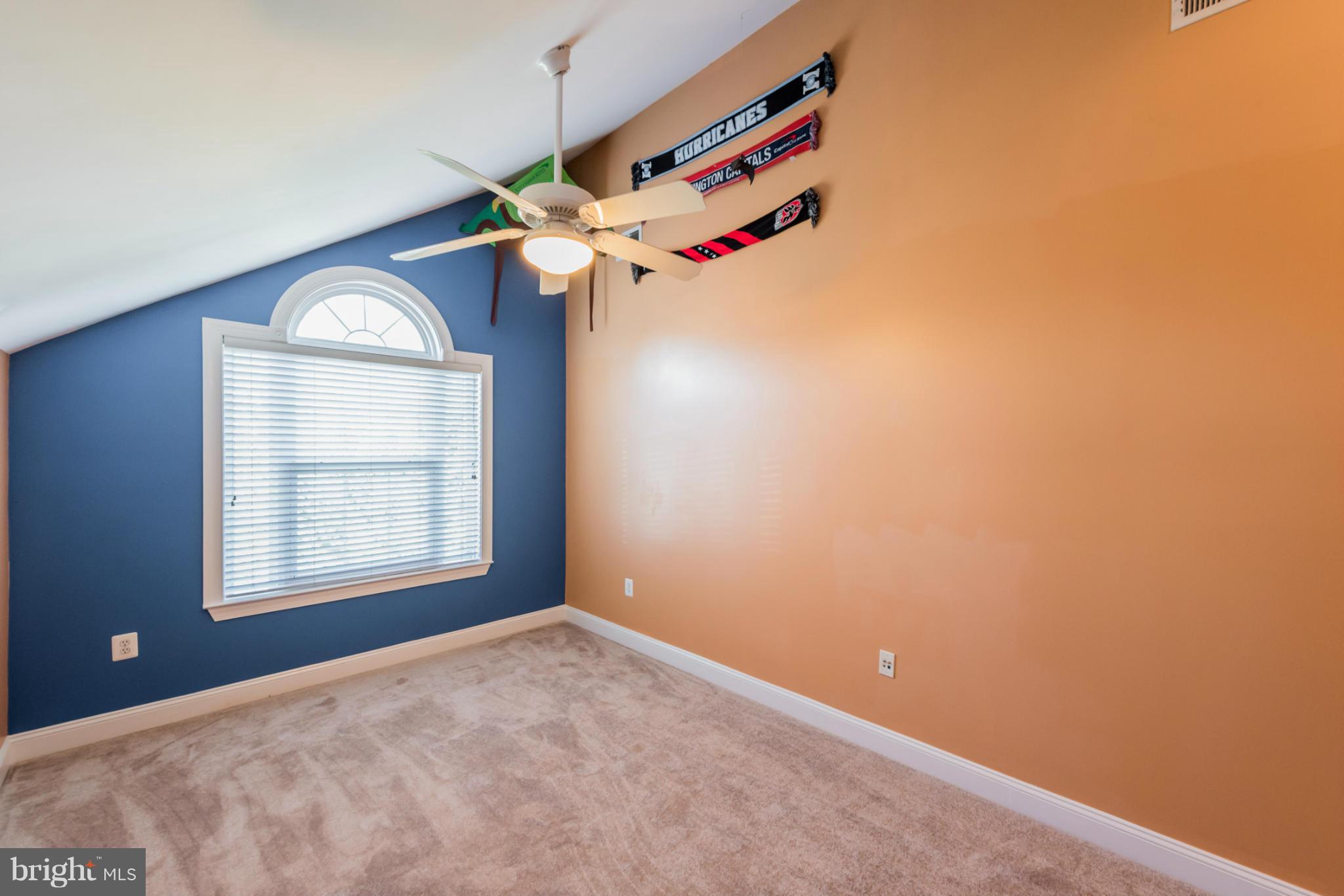 3401 Evans Road Huntingtown, MD 20639 - Photo 18 of 30 an empty room with a ceiling fan and window