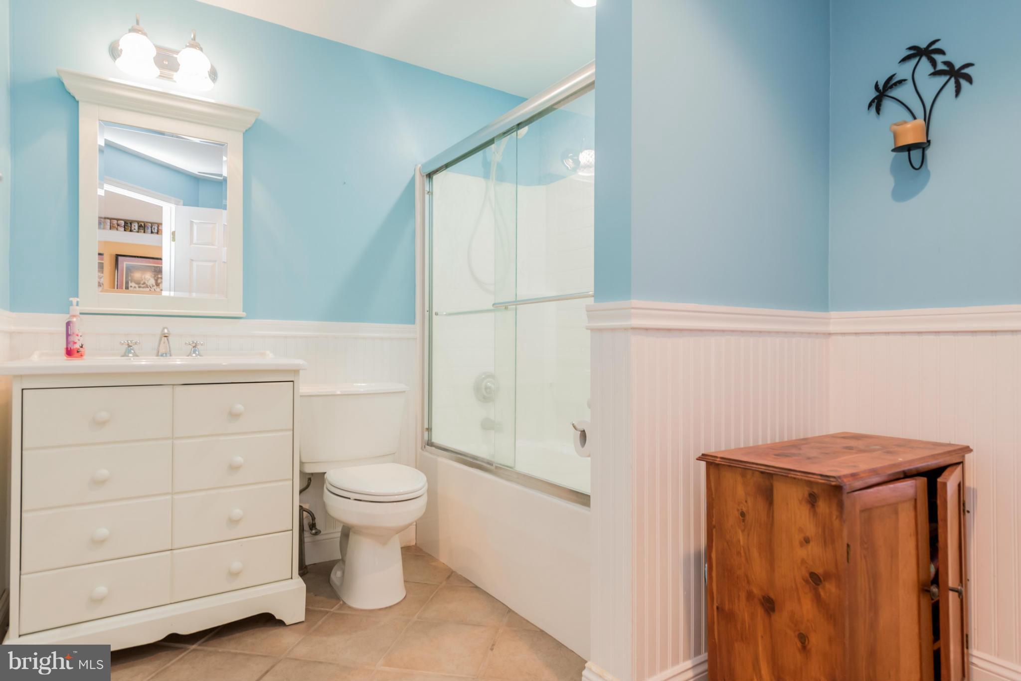 3401 Evans Road Huntingtown, MD 20639 - Photo 23 of 30 a bathroom with a sink a toilet and shower
