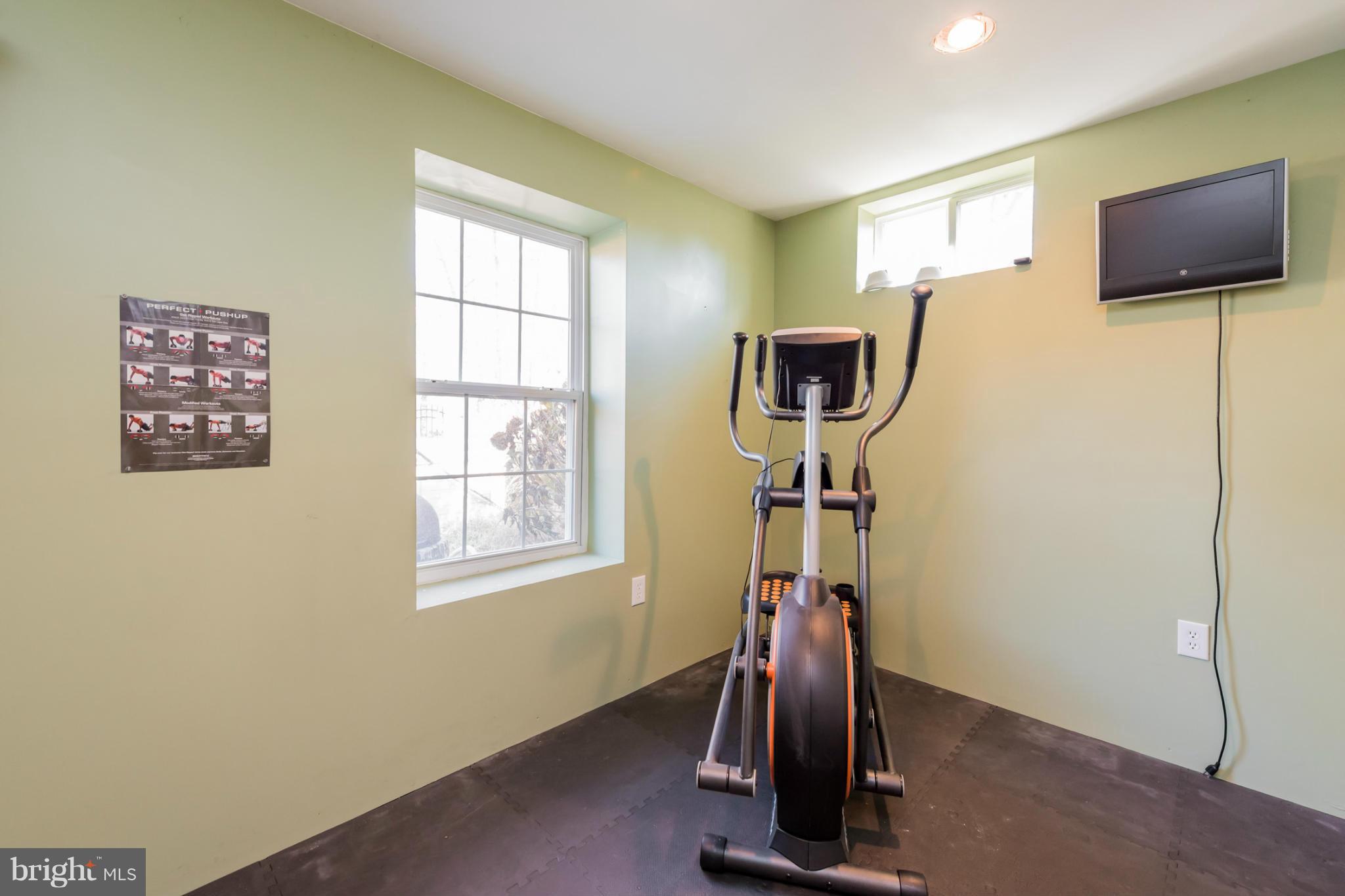 3401 Evans Road Huntingtown, MD 20639 - Photo 24 of 30 a view of a livingroom with gym equipment