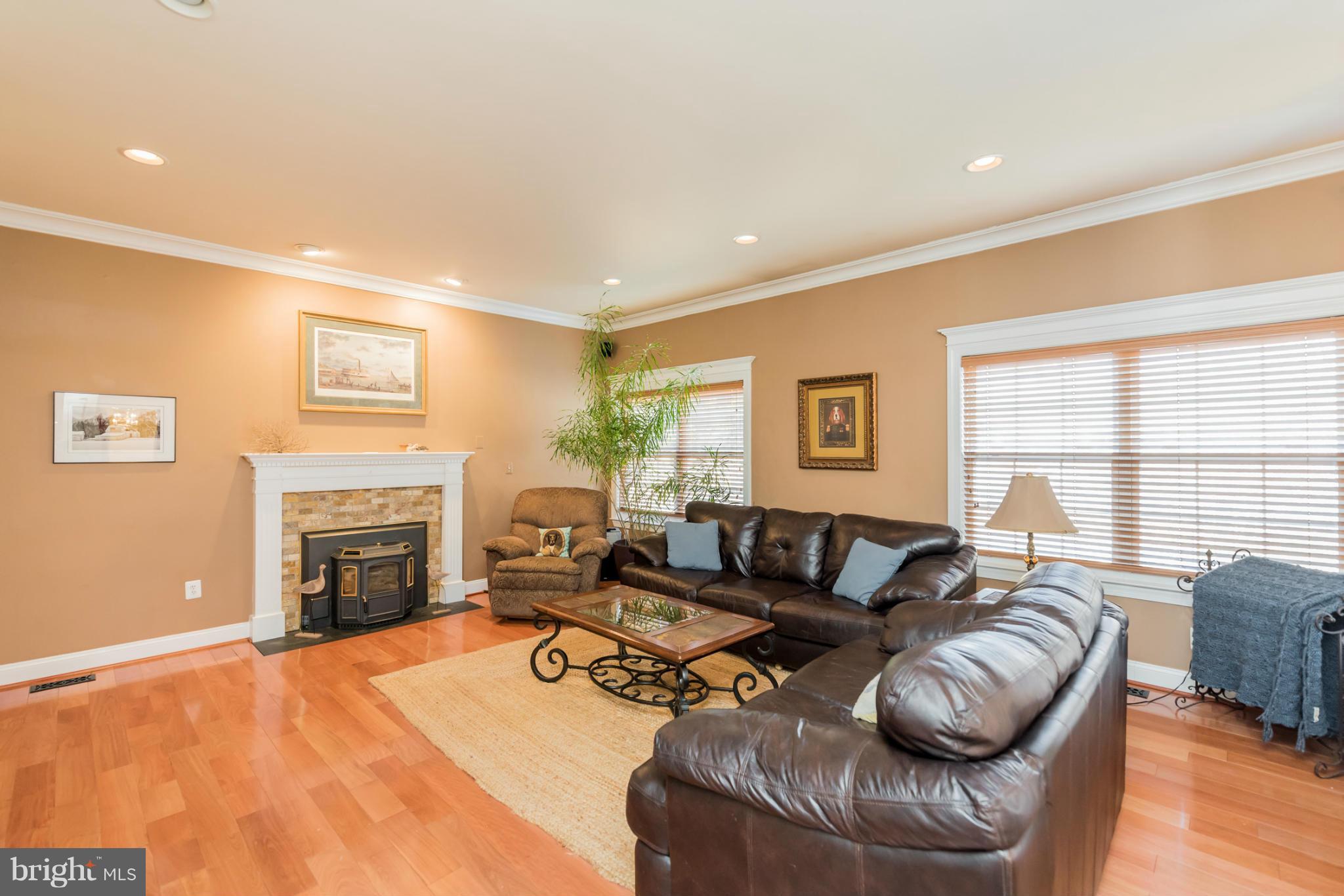 3401 Evans Road Huntingtown, MD 20639 - Photo 8 of 30 a living room with furniture a fireplace and a flat screen tv