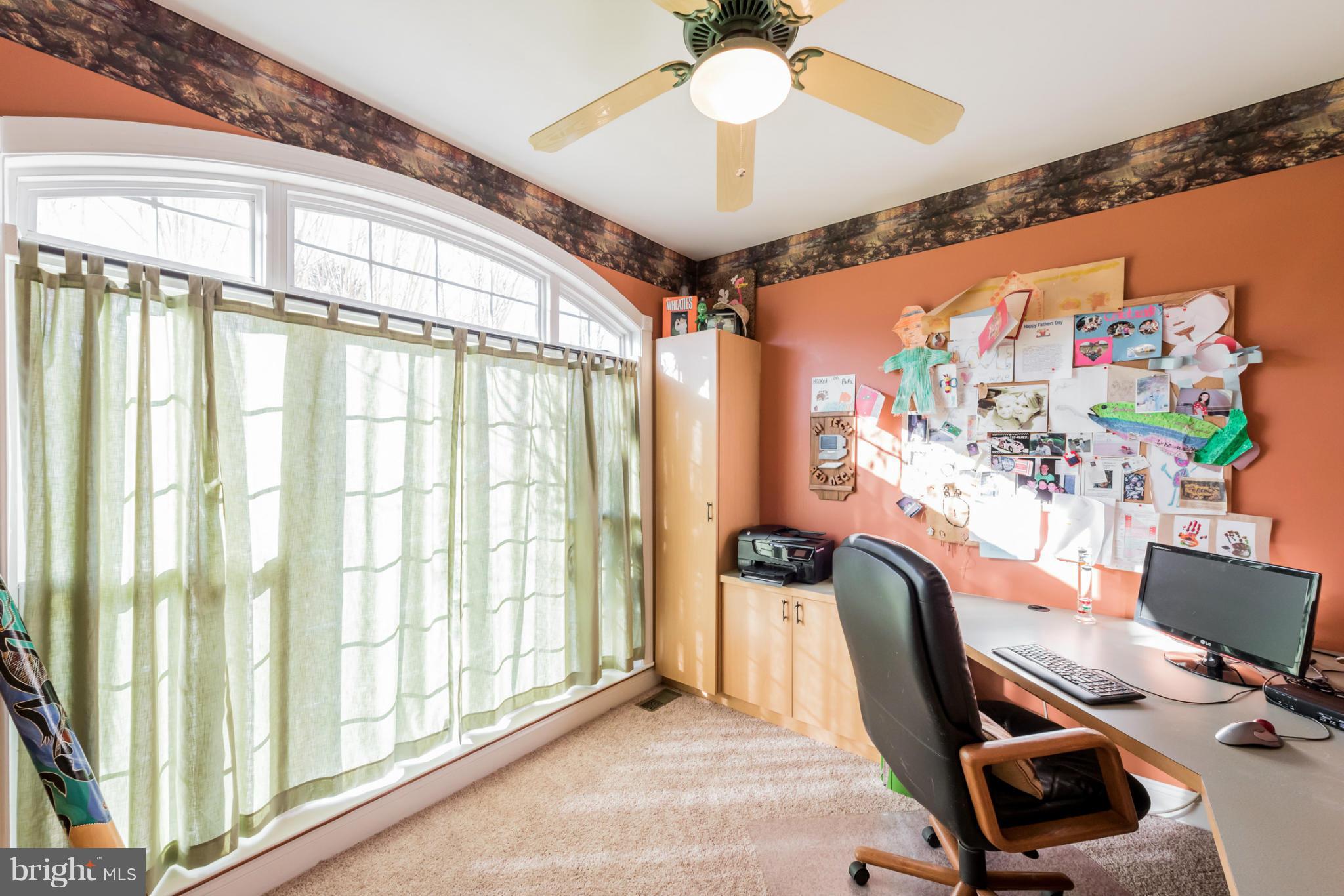 3401 Evans Road Huntingtown, MD 20639 - Photo 9 of 30 a view of a workspace with furniture and a window