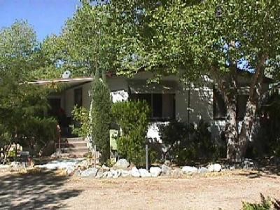 12388 Oasis Road Pinon Hills, CA 92372 - Photo 1 of 1 a view of house with a yard