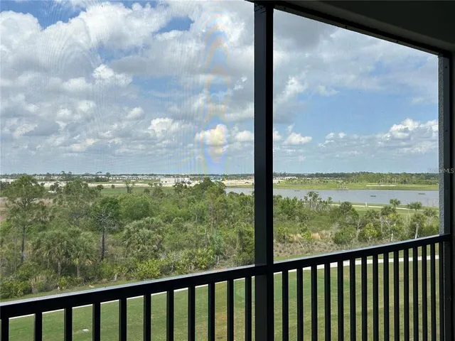 a view of a lake with a yard