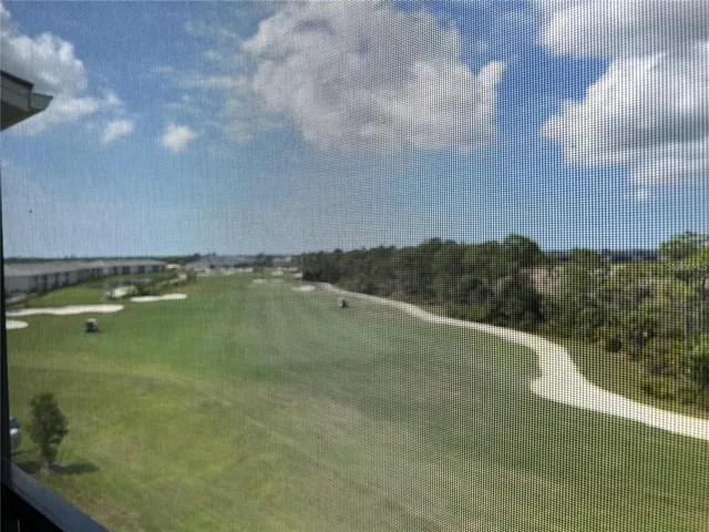 a view of a large building with a yard