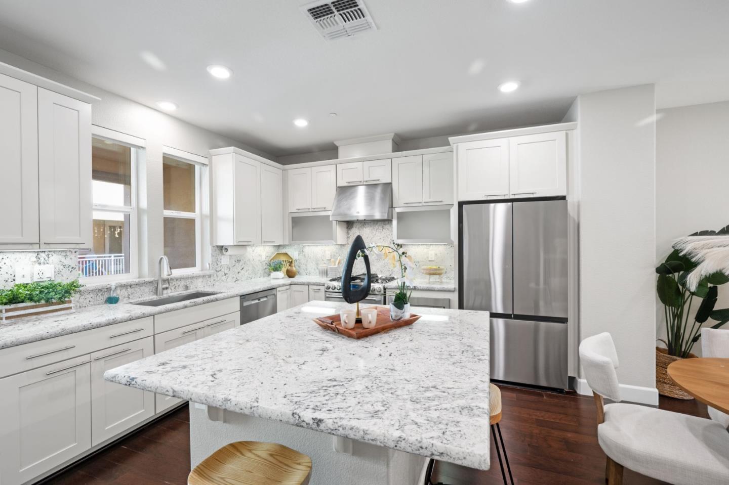 5977 Larkstone Loop San Jose, CA 95123 - Photo 19 of 63 a kitchen with refrigerator and window
