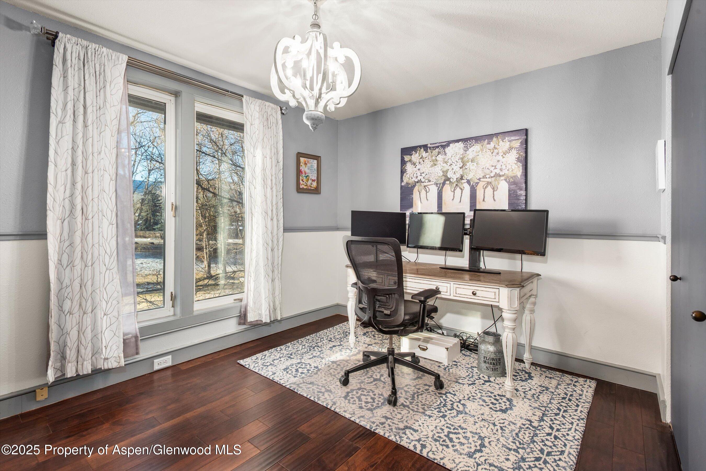 93 Quail Run Carbondale, CO 81623 - Photo 23 of 36 a view of a dining room with furniture window and wooden floor