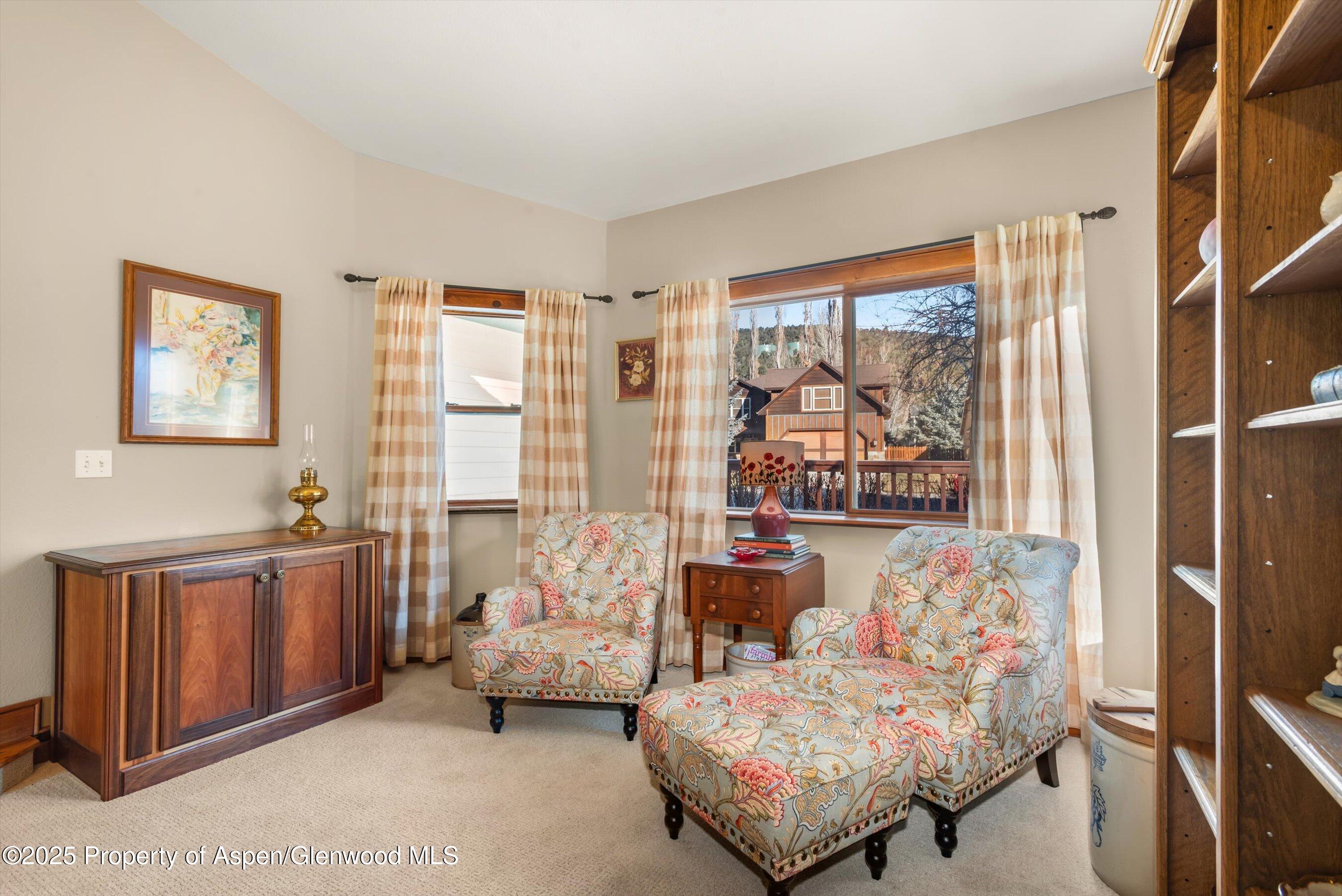 93 Quail Run Carbondale, CO 81623 - Photo 8 of 36 a bedroom with furniture and a large window
