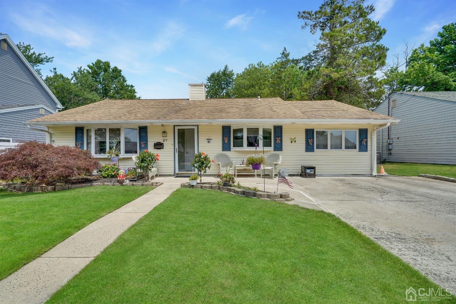 27 Raleigh Road Edison, NJ 08817 - Photo 1 of 29 a house view with a garden space and patio