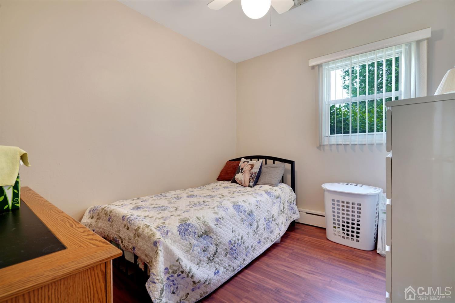 27 Raleigh Road Edison, NJ 08817 - Photo 13 of 29 a bedroom with a bed and a window